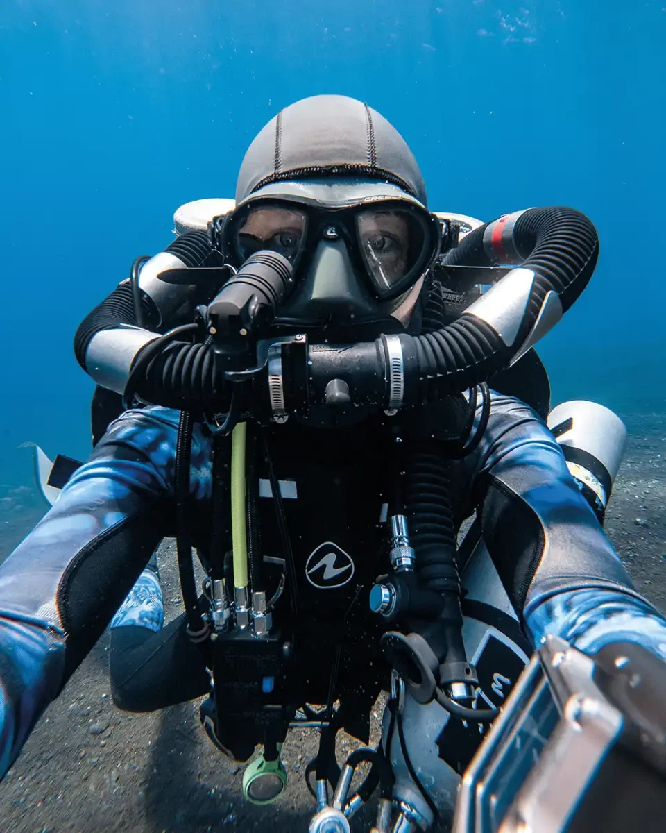 Jasmine pictured taking a selfie while wearing the complicated array of closed circuit rebreather equipment