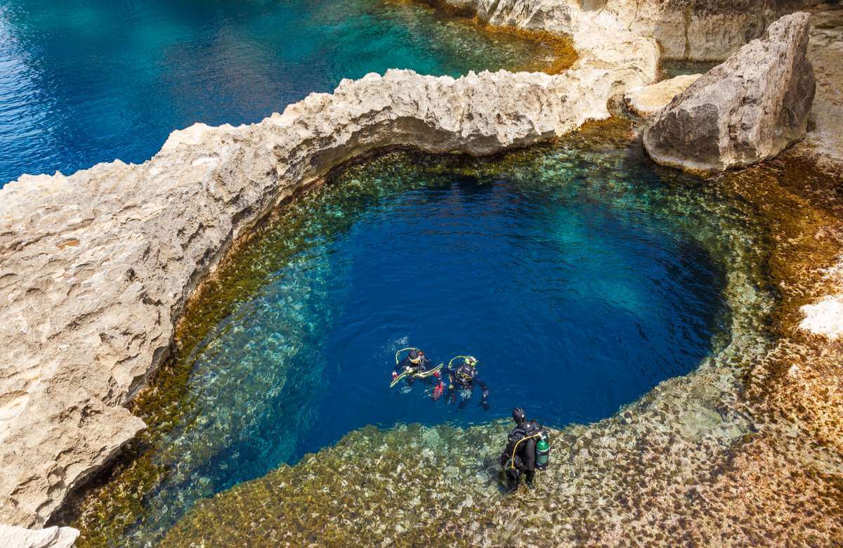 divers enter the water in Gozo Malta