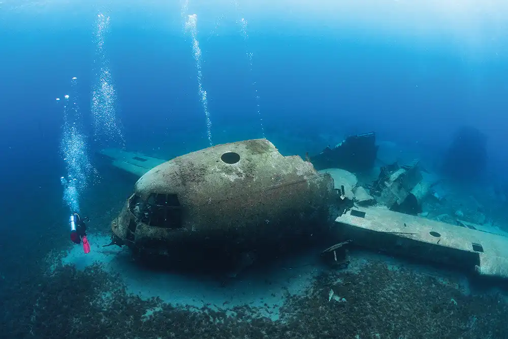 the broken wreck of a c130 hercules aircraft sunk off the coast of Aqaba