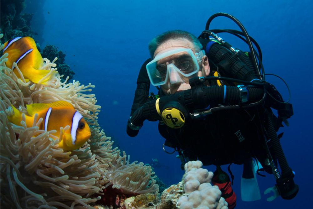 a diver demonstrating the pros and cons of rebreather diving