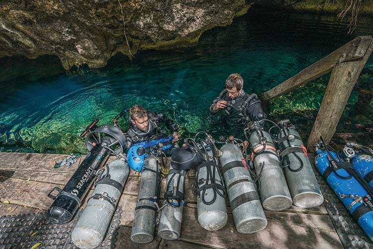 cave divers preparing to dive in cenote blue abyss