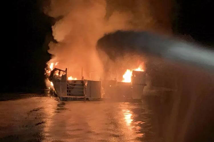 firefighters attempting to extinguish fire on the mv conception