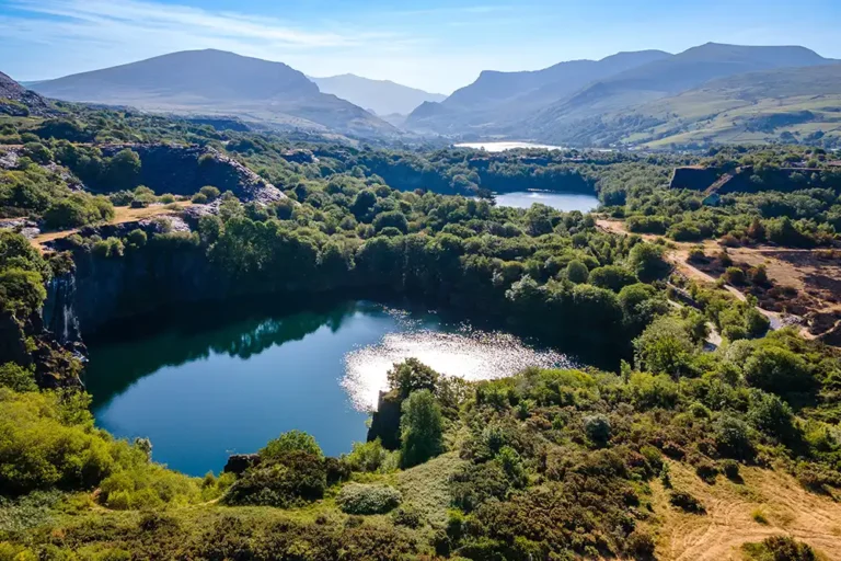 disused quarry flooded with water in the welsh mountains