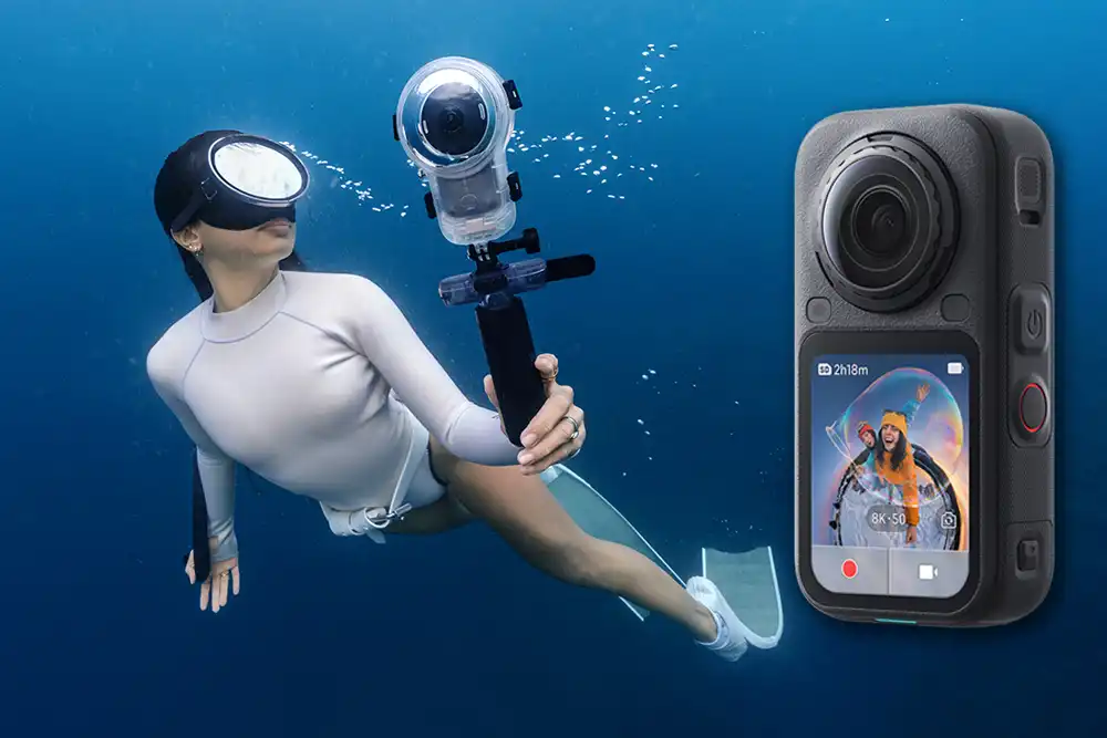 underwater picture of a woman freediving with an Insta360 X6 action camera in its underwater housing