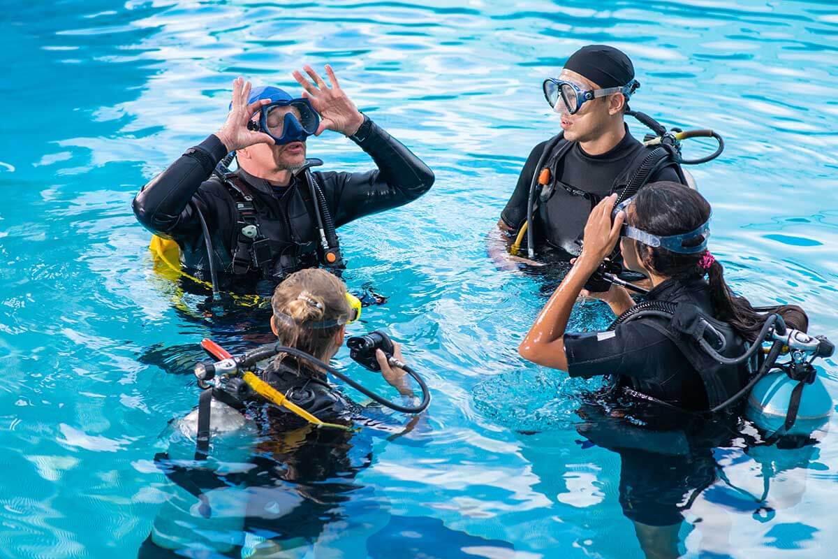 scuba diving students in a pool
