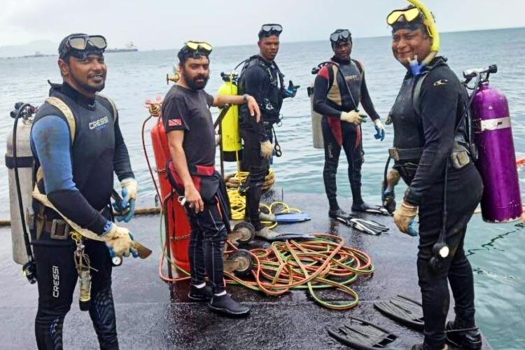 a picture of the divers trapped in the Trinidad pipeline before the accident happened