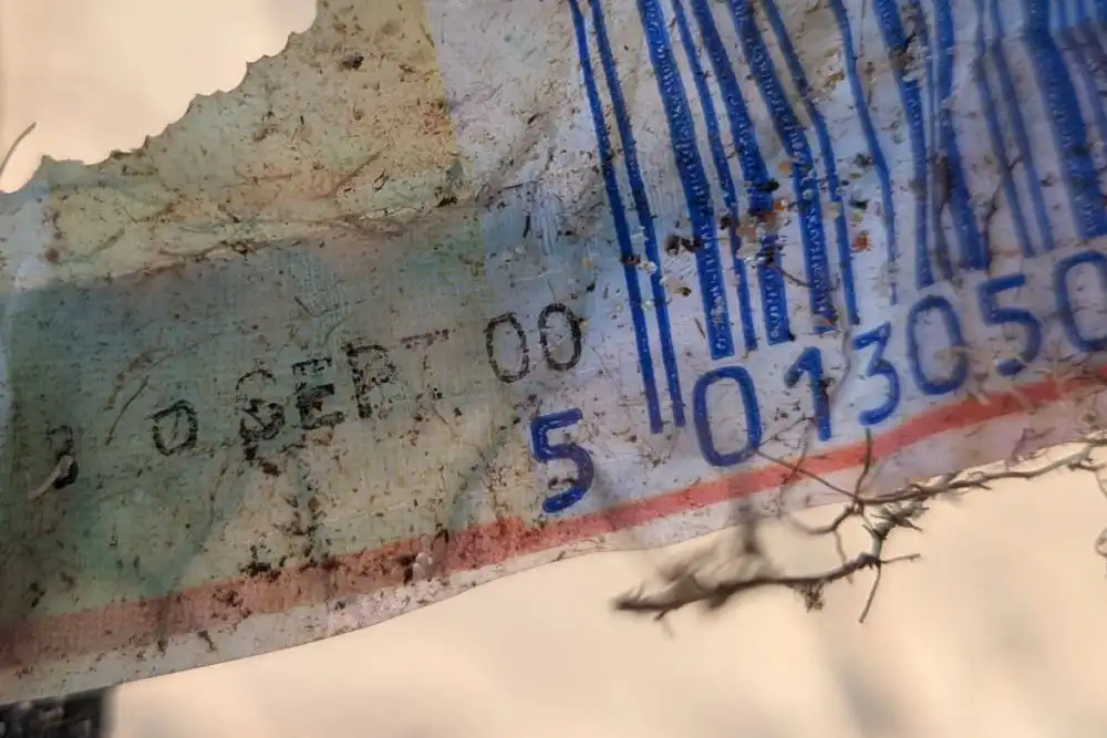 a candy bar wrapper that is at least 25 years old, found on a beach.