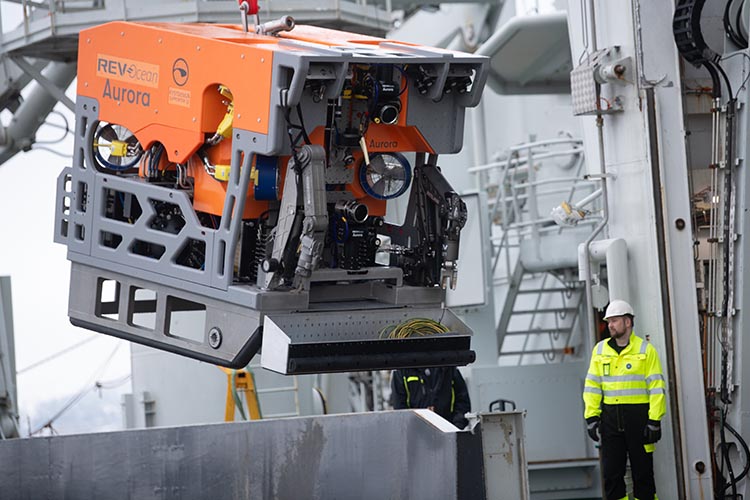 the deep sea ROV Aurora hoisted on the deck of its command vessel