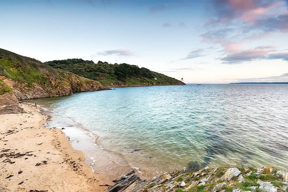 a picture from the beach overlooking St Anthony Head in Cornwall